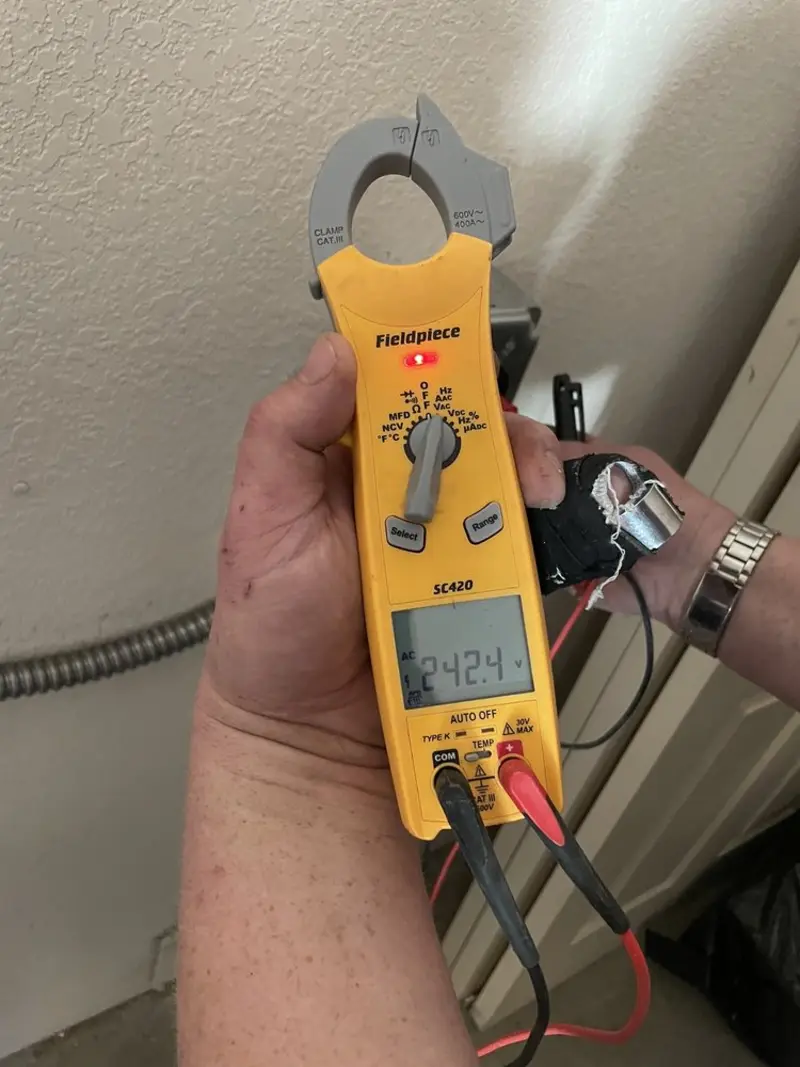 Voltage testing with clamp meter during Outlet Installation in Ridgeland